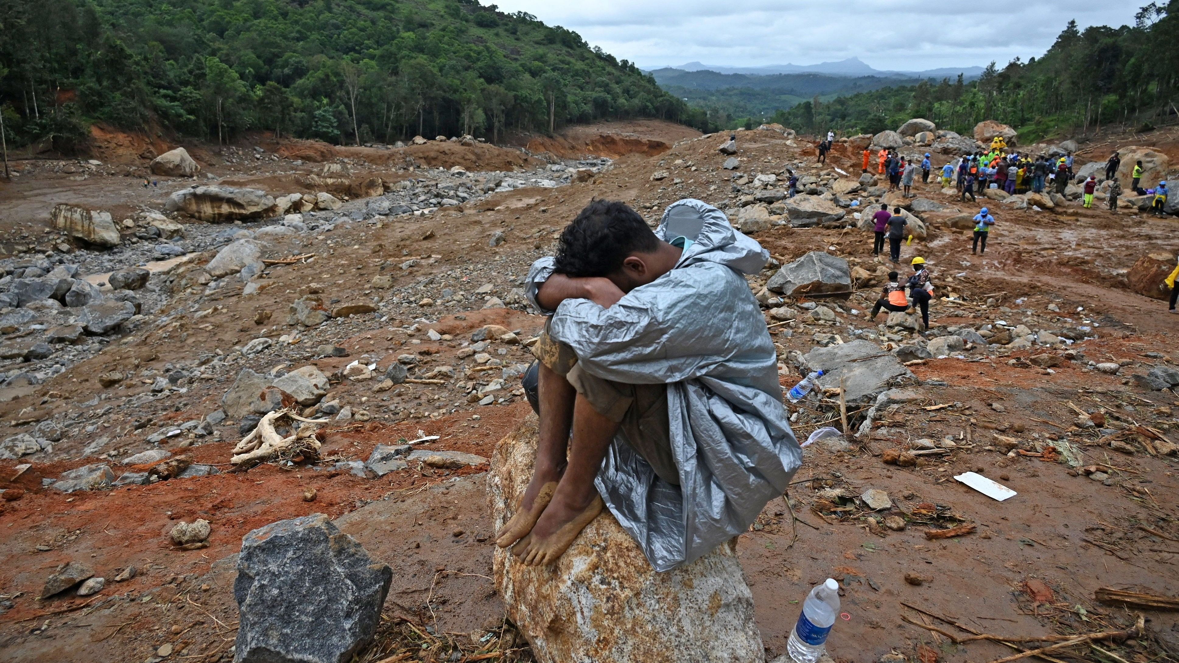 <div class="paragraphs"><p>A resident of&nbsp;Mundakkai sits on a bolder amid the landslide hit area, where he lost family members, in Wayanad.</p></div>